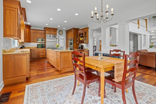 543 Lower Hollow Rd, Dorset, VT 05251 - dining space featuring wood finished floors, recessed lighting, and a chandelier