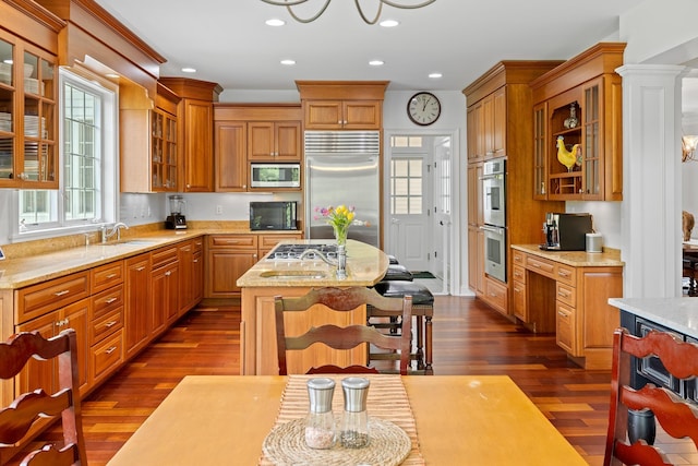 543 Lower Hollow Rd, Dorset, VT 05251 - kitchen featuring built in appliances, dark wood-type flooring, a center island, recessed lighting, and brown cabinetry
