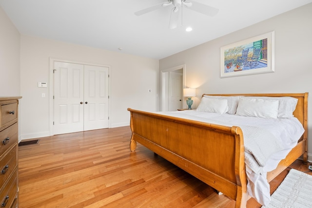 543 Lower Hollow Rd, Dorset, VT 05251 - bedroom with light wood finished floors, baseboards, ceiling fan, and a closet