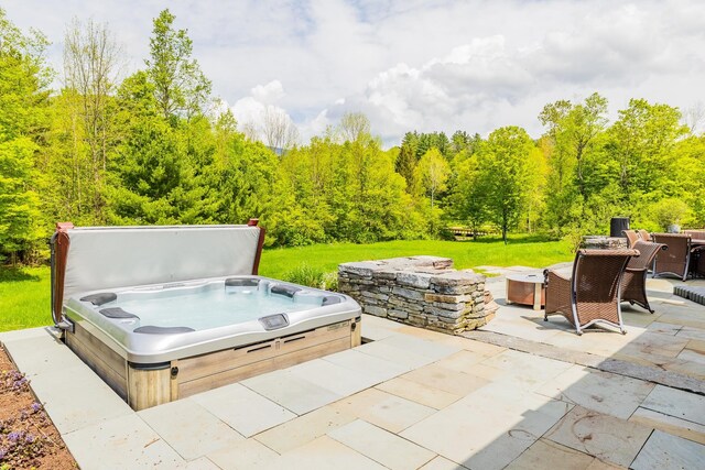543 Lower Hollow Rd, Dorset, VT 05251 - view of patio featuring a covered hot tub and a wooded view