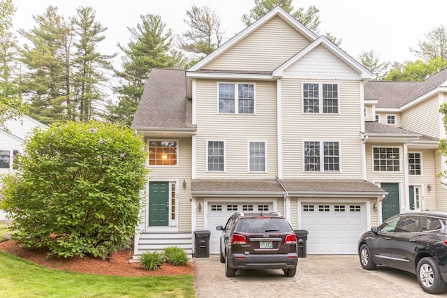 60 Barrington Ave Unit 60, Nashua, NH 03062 - view of front of home featuring driveway, a garage, and a shingled roof