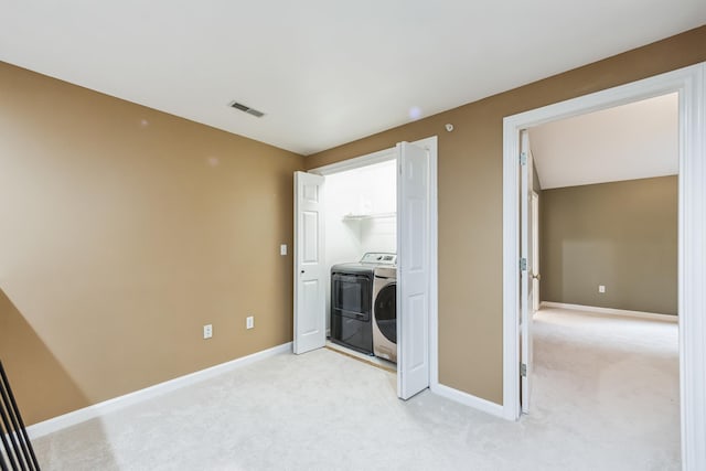 60 Barrington Ave Unit 60, Nashua, NH 03062 - washroom featuring washer / clothes dryer, light colored carpet, and baseboards