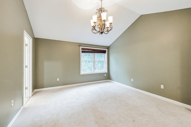 60 Barrington Ave Unit 60, Nashua, NH 03062 - spare room with lofted ceiling, a chandelier, light carpet, and baseboards
