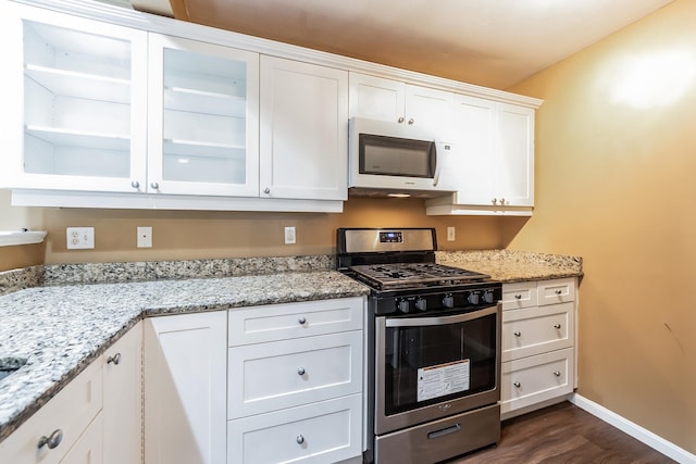 60 Barrington Ave Unit 60, Nashua, NH 03062 - kitchen featuring stainless steel gas stove, white microwave, white cabinets, and baseboards