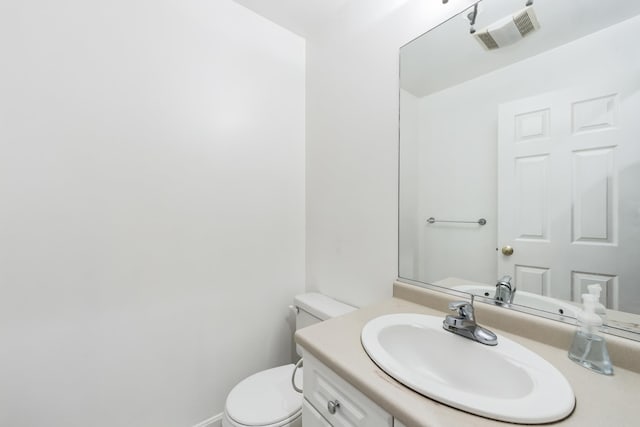 60 Barrington Ave Unit 60, Nashua, NH 03062 - half bathroom with toilet, vanity, and baseboards