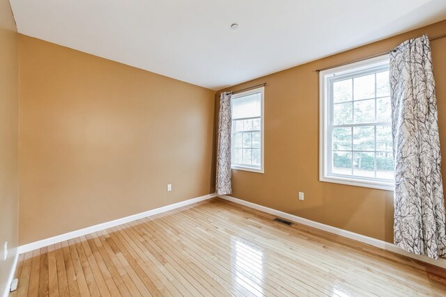 60 Barrington Ave Unit 60, Nashua, NH 03062 - empty room with baseboards and hardwood / wood-style flooring