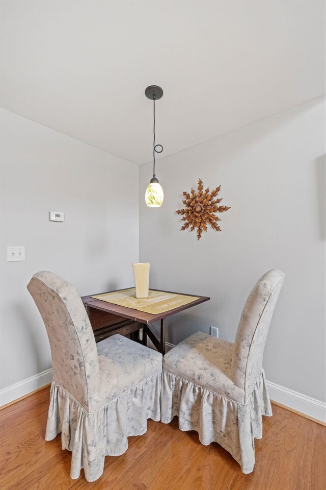 48 Landing Ln Unit 15, Laconia, NH 03246 - dining space with baseboards and wood finished floors