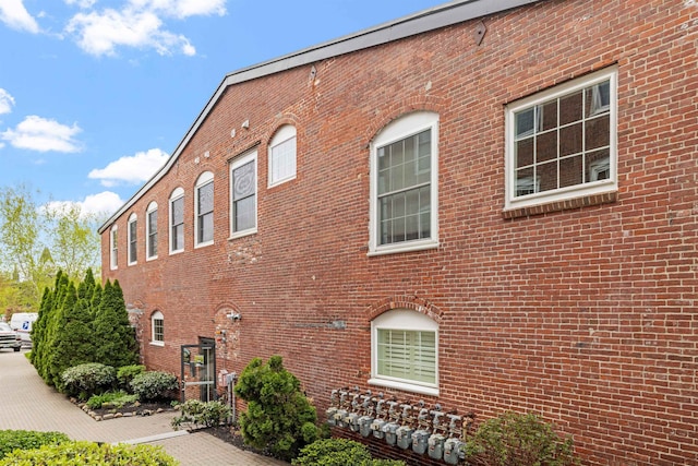 48 Landing Ln Unit 15, Laconia, NH 03246 - view of side of property featuring brick siding