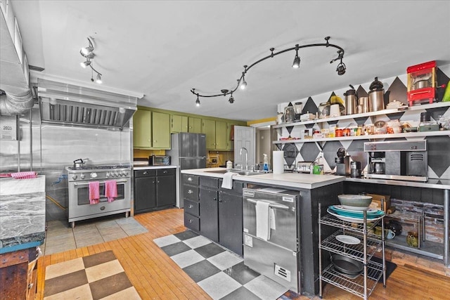 1460 Main St, Waitsfield, VT 05673 - kitchen featuring stainless steel appliances, green cabinetry, ventilation hood, light countertops, and light wood-type flooring