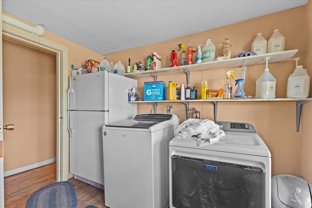 1460 Main St, Waitsfield, VT 05673 - laundry area featuring washer and clothes dryer, wood finished floors, and baseboards