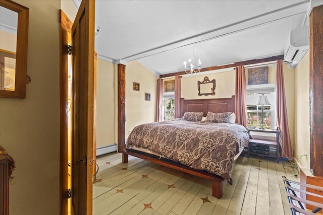 1460 Main St, Waitsfield, VT 05673 - bedroom featuring a baseboard heating unit, a wall unit AC, wood-type flooring, and a chandelier