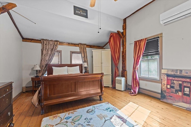 1460 Main St, Waitsfield, VT 05673 - bedroom featuring an AC wall unit, hardwood / wood-style floors, multiple windows, and lofted ceiling