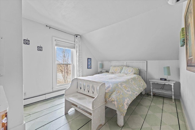 1460 Main St, Waitsfield, VT 05673 - bedroom with a baseboard heating unit, lofted ceiling, and tile patterned floors