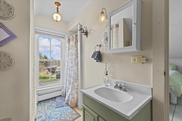 1460 Main St, Waitsfield, VT 05673 - full bath featuring a baseboard heating unit, vanity, and vaulted ceiling