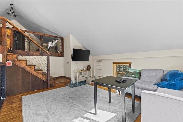1460 Main St, Waitsfield, VT 05673 - living area with vaulted ceiling, stairs, wood finished floors, and a baseboard radiator
