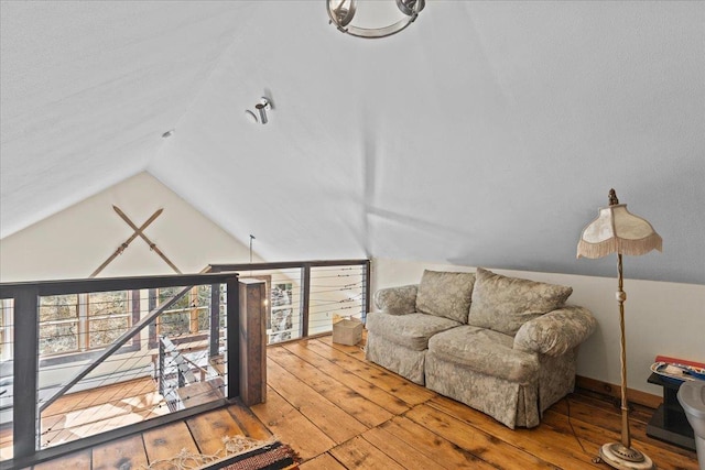 1460 Main St, Waitsfield, VT 05673 - living area featuring vaulted ceiling, wood-type flooring, and baseboards