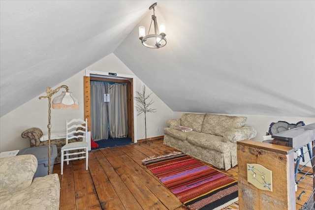1460 Main St, Waitsfield, VT 05673 - living room featuring hardwood / wood-style flooring, vaulted ceiling, and a chandelier