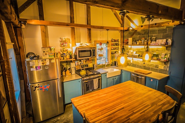 1460 Main St, Waitsfield, VT 05673 - kitchen featuring stainless steel appliances, a sink, butcher block countertops, and concrete flooring