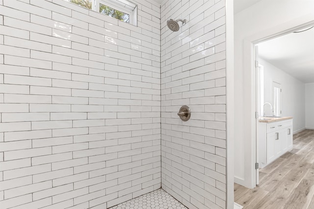 15 Highland Ave, Claremont, NH 03743 - full bath featuring tiled shower, wood finished floors, vanity, and baseboards