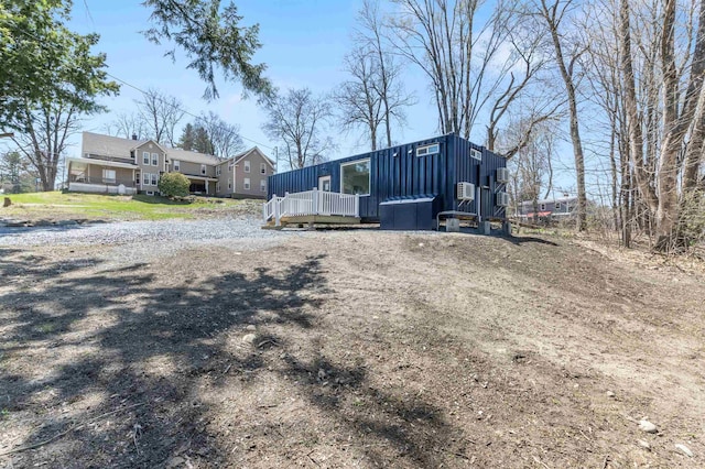 15 Highland Ave, Claremont, NH 03743 - view of front of home featuring a deck and board and batten siding
