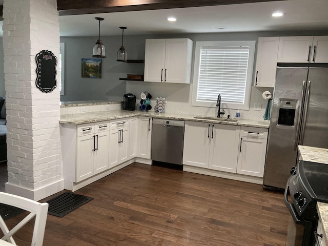 319 Main St, Montgomery, VT 05471 - kitchen with a sink, stainless steel appliances, white cabinets, dark wood finished floors, and recessed lighting