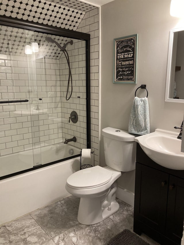 319 Main St, Montgomery, VT 05471 - bathroom with vanity, enclosed tub / shower combo, and toilet