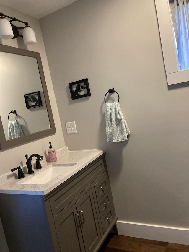 319 Main St, Montgomery, VT 05471 - bathroom featuring vanity and baseboards
