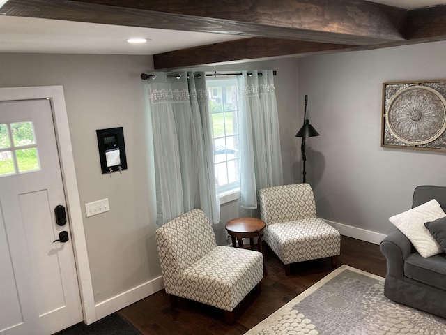 319 Main St, Montgomery, VT 05471 - living area with healthy amount of natural light, baseboards, dark wood finished floors, beamed ceiling, and recessed lighting