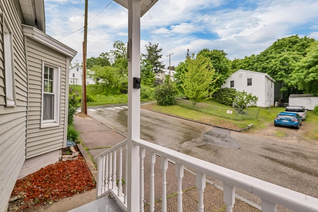 31 Prospect St, Franklin, NH 03235 - view of yard with asphalt driveway and a porch