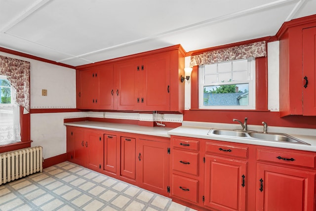 31 Prospect St, Franklin, NH 03235 - kitchen featuring radiator, a sink, light countertops, light flooring, and baseboards