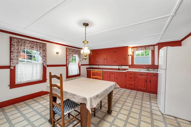 31 Prospect St, Franklin, NH 03235 - dining space featuring light floors, baseboards, and crown molding