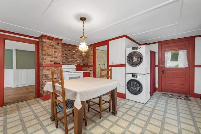 31 Prospect St, Franklin, NH 03235 - dining area featuring stacked washer / dryer and light floors