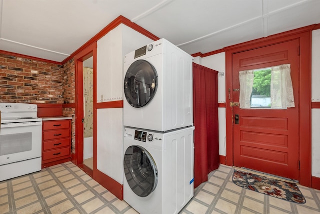 31 Prospect St, Franklin, NH 03235 - laundry area with stacked washer and clothes dryer and light flooring