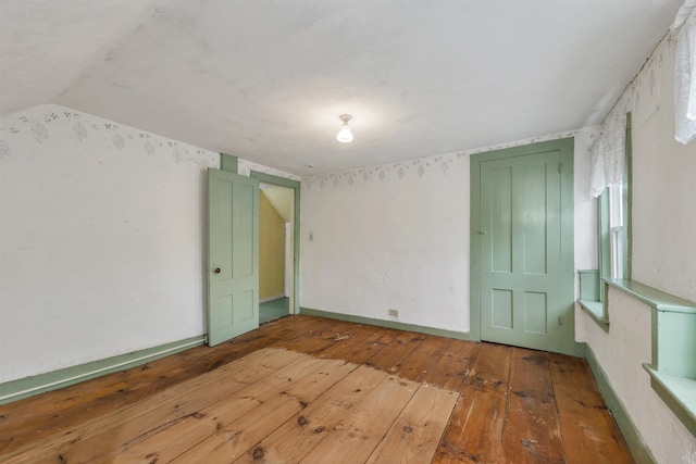 31 Prospect St, Franklin, NH 03235 - empty room with wood-type flooring and baseboards
