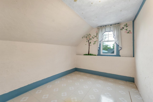 31 Prospect St, Franklin, NH 03235 - bonus room featuring vaulted ceiling, tile patterned floors, and baseboards