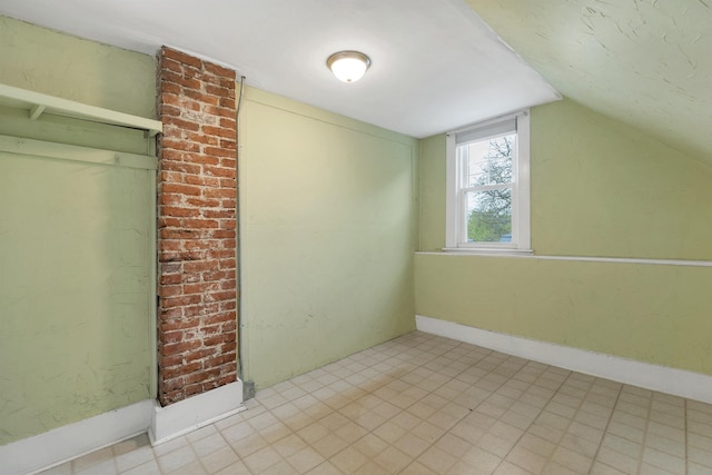 31 Prospect St, Franklin, NH 03235 - bonus room featuring vaulted ceiling and tile patterned floors