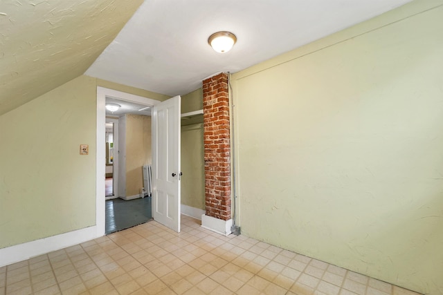 31 Prospect St, Franklin, NH 03235 - spare room with radiator heating unit and vaulted ceiling