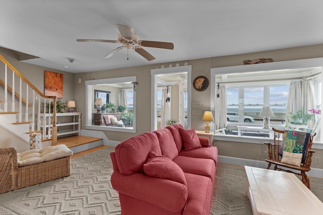 745 Ocean Blvd, Hampton, NH 03842 - living room with stairway, a ceiling fan, and baseboards