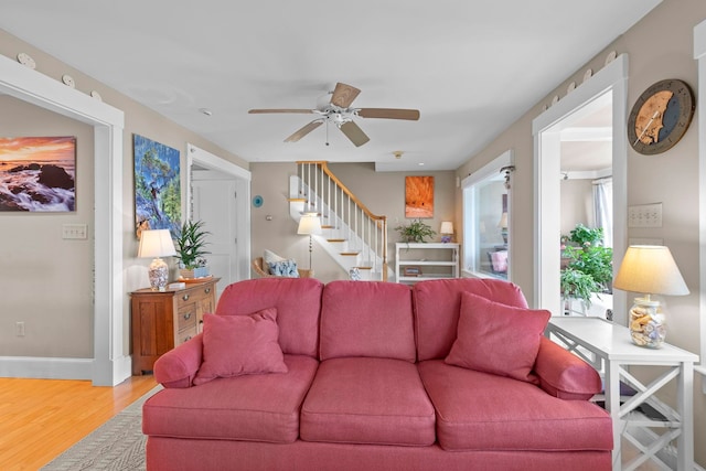 745 Ocean Blvd, Hampton, NH 03842 - living room with wood finished floors, stairway, ceiling fan, and baseboards