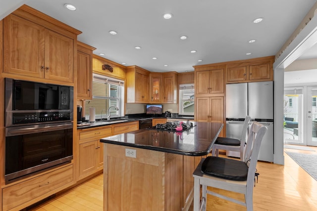 745 Ocean Blvd, Hampton, NH 03842 - kitchen featuring freestanding refrigerator, gas cooktop, a sink, light wood-style flooring, and built in microwave