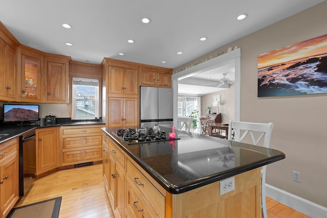745 Ocean Blvd, Hampton, NH 03842 - kitchen featuring black appliances, light wood-style floors, recessed lighting, ceiling fan, and a center island