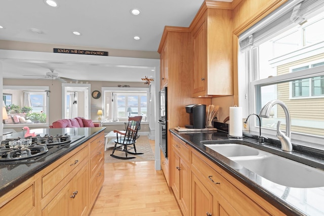 745 Ocean Blvd, Hampton, NH 03842 - kitchen featuring a sink, black gas stovetop, light wood-type flooring, recessed lighting, and dark stone counters