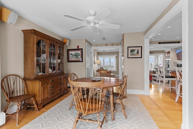 745 Ocean Blvd, Hampton, NH 03842 - dining area featuring a ceiling fan, baseboard heating, light wood-type flooring, baseboards, and recessed lighting