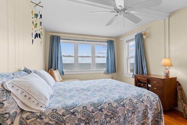 745 Ocean Blvd, Hampton, NH 03842 - bedroom with wood finished floors, ceiling fan, and a water view