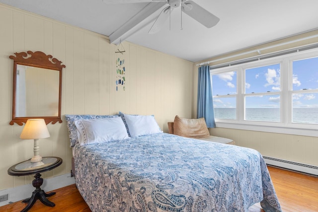 745 Ocean Blvd, Hampton, NH 03842 - bedroom with wood finished floors, a baseboard radiator, ceiling fan, and beamed ceiling