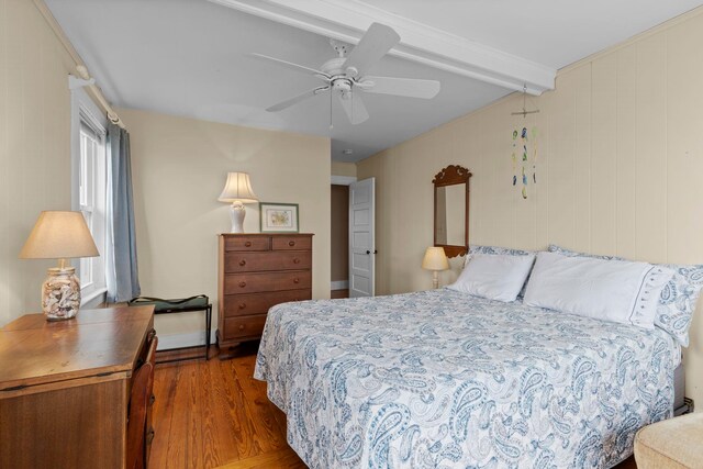 745 Ocean Blvd, Hampton, NH 03842 - bedroom featuring beam ceiling, wood finished floors, and ceiling fan