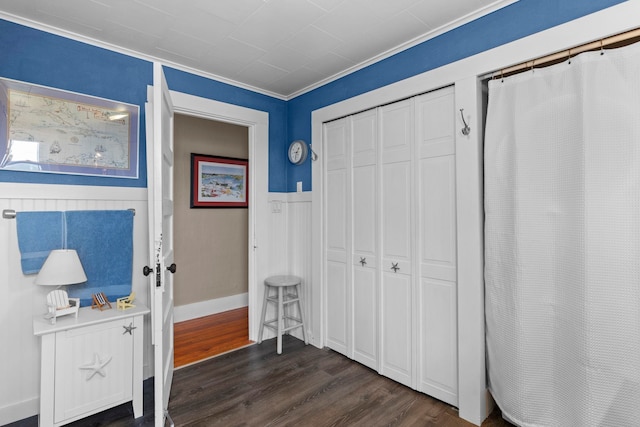 745 Ocean Blvd, Hampton, NH 03842 - bedroom featuring dark wood-type flooring, a closet, and ornamental molding