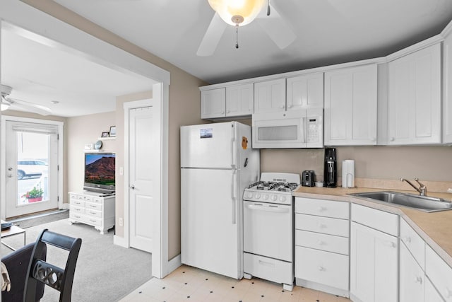 745 Ocean Blvd, Hampton, NH 03842 - kitchen featuring white appliances, a ceiling fan, a sink, light countertops, and white cabinets