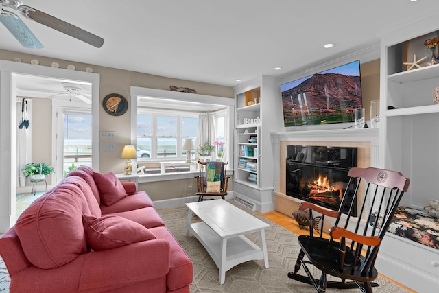 745 Ocean Blvd, Hampton, NH 03842 - living area featuring ceiling fan, wood finished floors, a glass covered fireplace, baseboards, and recessed lighting