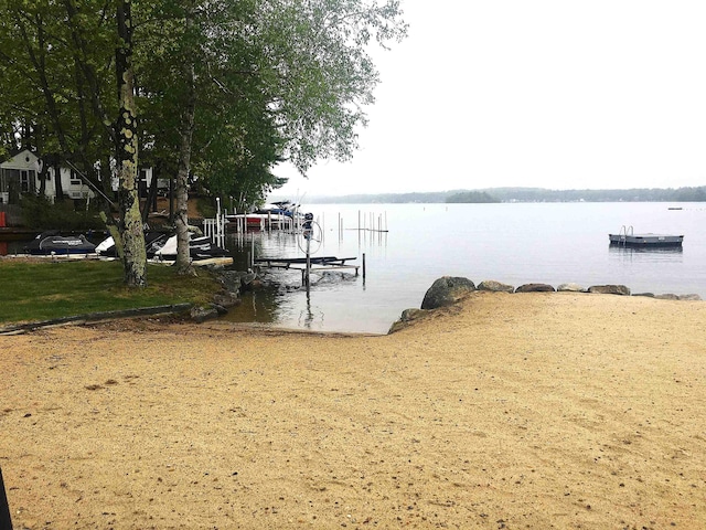556 Weirs Blvd Unit 6, Laconia, NH 03246 - dock area with a water view and boat lift